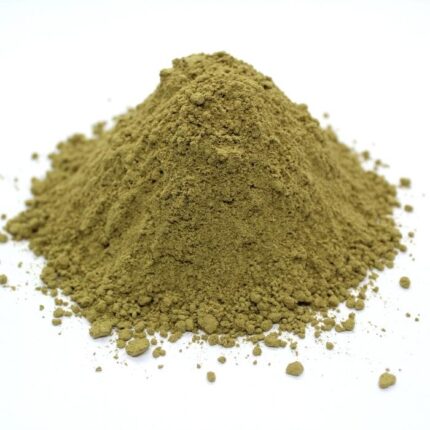 A small pile of wildcrafted damiana powder sits on a crisp white background.
