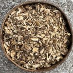 Organic Burdock Root dried cut pieces in a coconut bowl