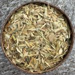 Organic oat straw dried herb in coconut bowl