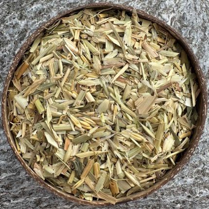 Organic oat straw dried herb in coconut bowl